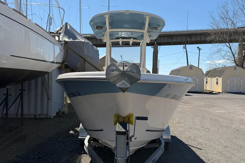 Slide: The Image of 2017 Sea Chaser 24 HFC boat on trailer, parked outdoors under clear sky. - 20