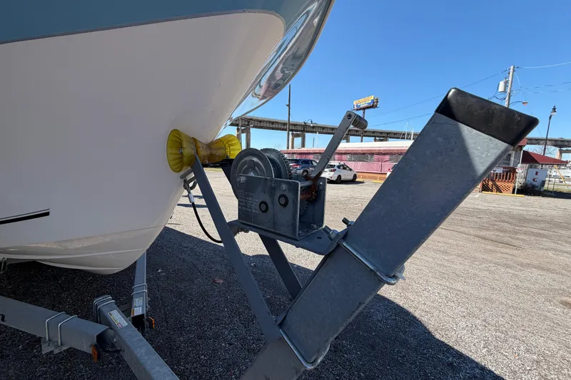 Slide: The Image of 2017 Sea Chaser 24 HFC boat on trailer with winch, parked outdoors. - 21