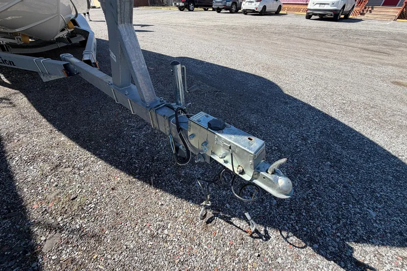 Slide: The Image of Trailer hitch of a 2017 Sea Chaser 24 HFC boat on gravel surface. - 22