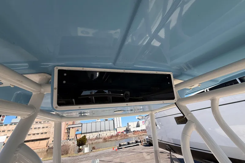 Slide: The Image of 2017 Sea Chaser 24 HFC boat interior, featuring a sleek overhead console and sturdy framework. - 27