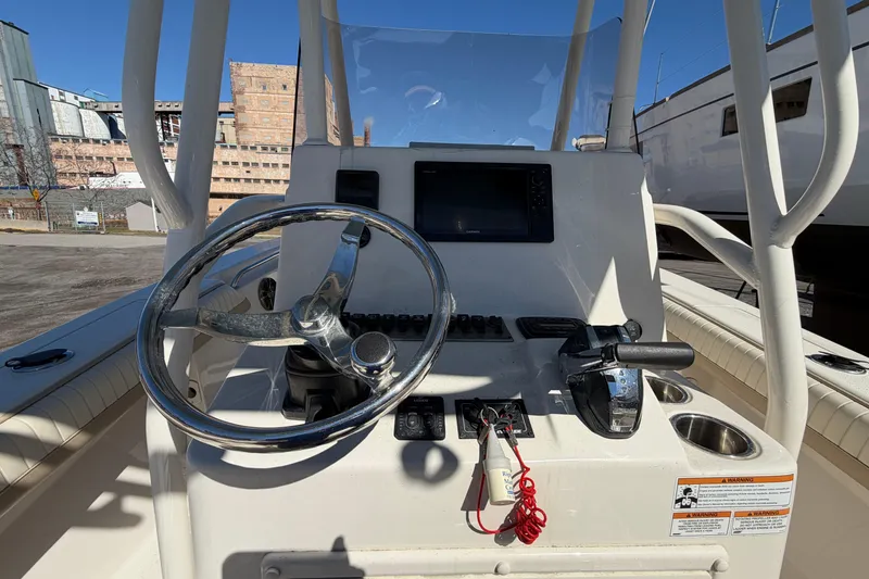 Slide: The Image of 2017 Sea Chaser 24 HFC boat console with steering wheel and controls. - 29