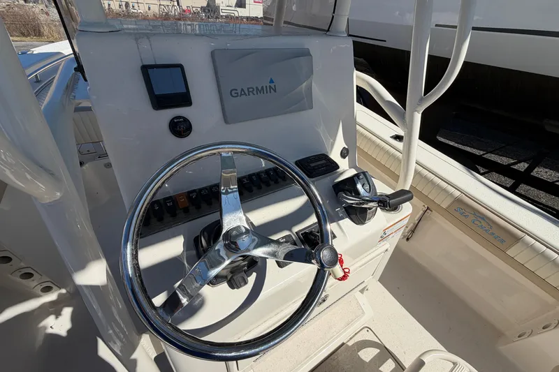 Slide: The Image of 2017 Sea Chaser 24 HFC boat console with Garmin navigation system and steering wheel. - 31
