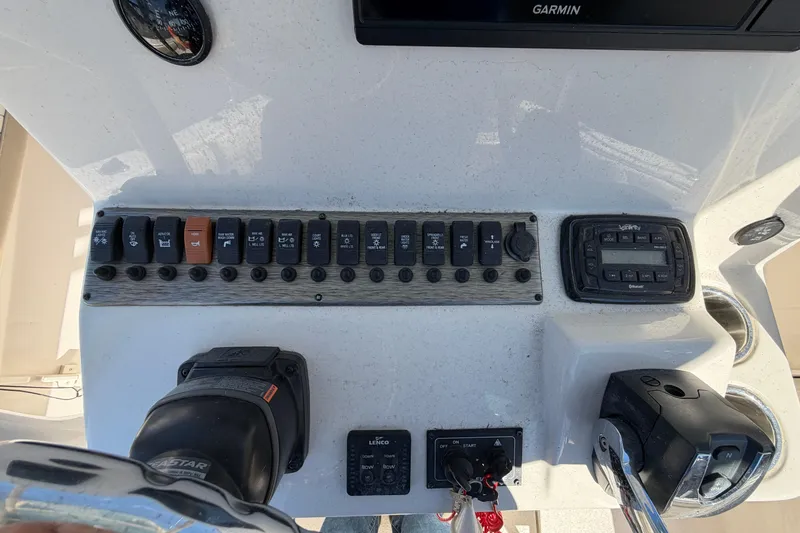 Slide: The Image of Control panel of a 2017 Sea Chaser 24 HFC boat with switches and gauges. - 32