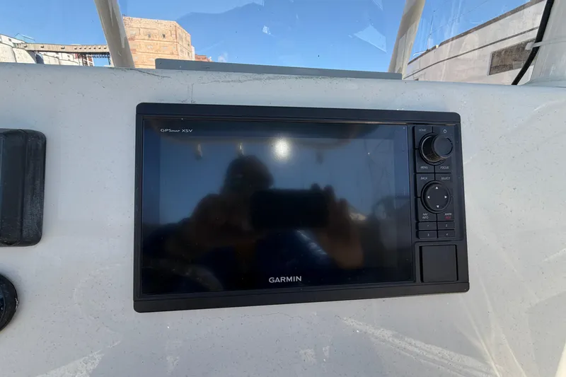 Slide: The Image of Garmin GPS display on 2017 Sea Chaser 24 HFC boat dashboard. - 33