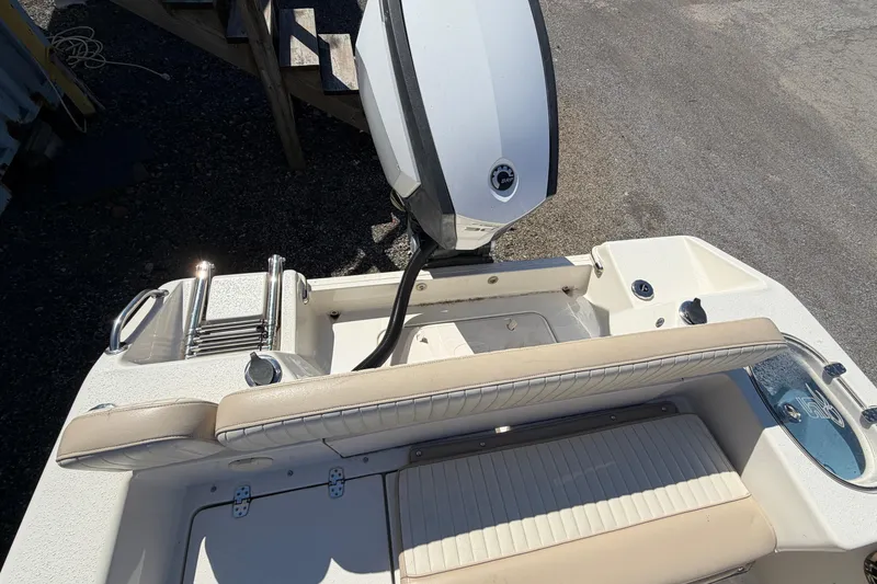 Slide: The Image of 2017 Sea Chaser 24 HFC boat interior with seating and motor view. - 35