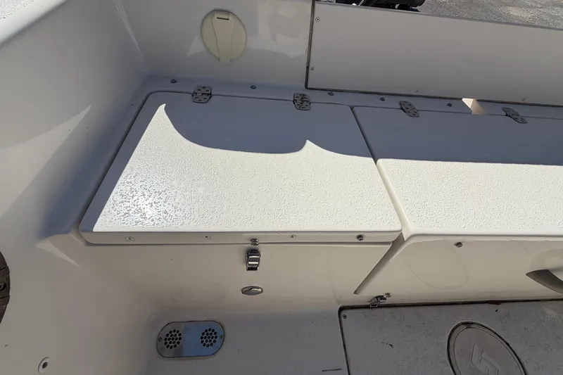 Slide: The Image of 2017 Sea Chaser 24 HFC boat storage compartments and seating area. - 42