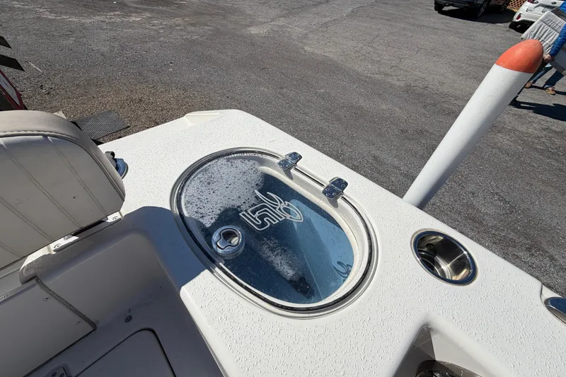 Slide: The Image of 2017 Sea Chaser 24 HFC boat deck with livewell and seating. - 45