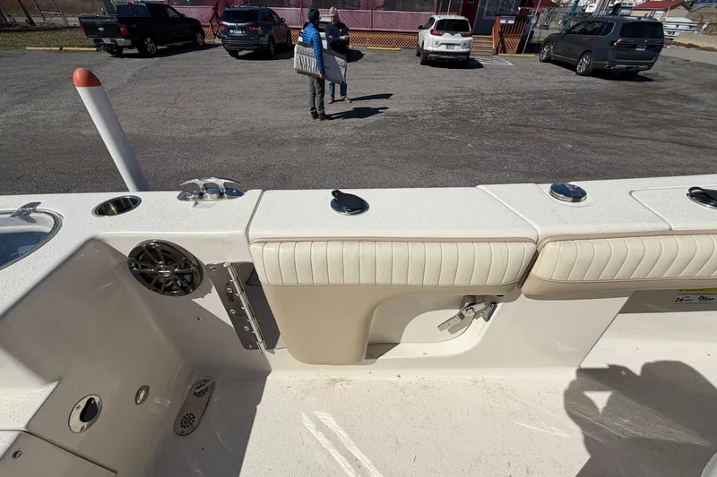 Slide: The Image of 2017 Sea Chaser 24 HFC boat interior with seating and speaker, parked in a lot. - 47