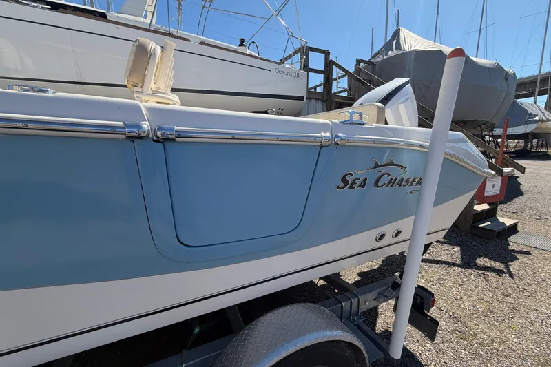 Slide: The Image of 2017 Sea Chaser 24 HFC boat on trailer, displayed outdoors in a marina. - 5