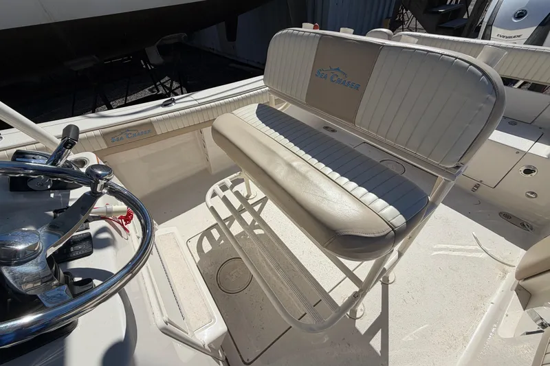 Slide: The Image of 2017 Sea Chaser 24 HFC boat interior with steering wheel and seating. - 52