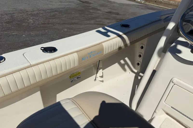 Slide: The Image of 2017 Sea Chaser 24 HFC boat interior with steering wheel and seating detail. - 54