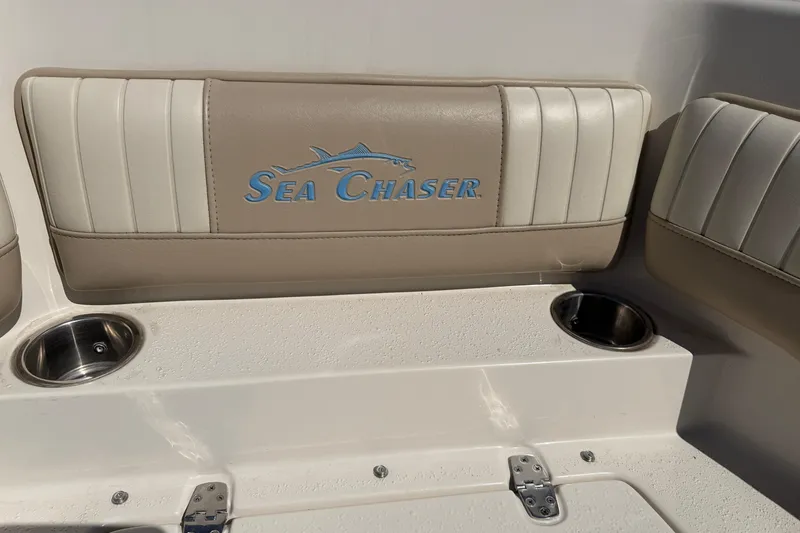 Slide: The Image of 2017 Sea Chaser 24 HFC boat seat with logo and cup holders. - 62