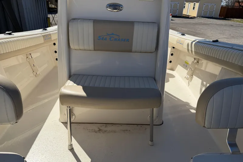 Slide: The Image of 2017 Sea Chaser 24 HFC boat interior with cushioned seating and branded logo. - 66