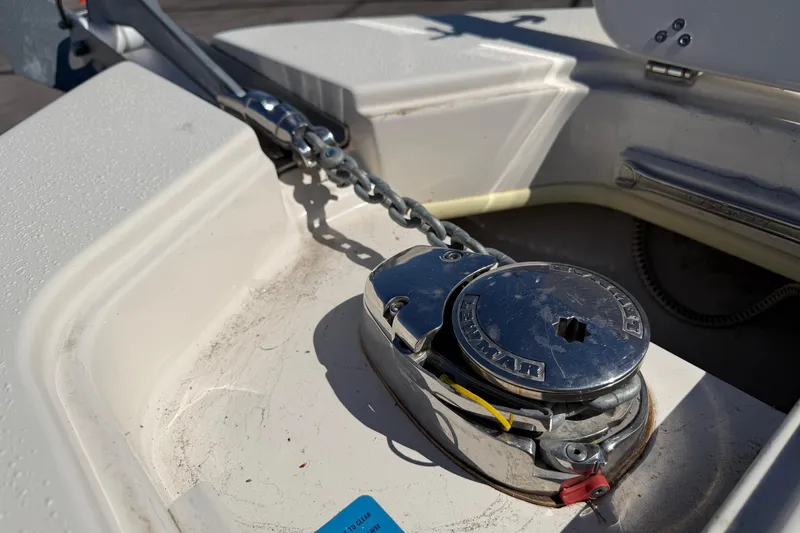 Slide: The Image of Anchor windlass on 2017 Sea Chaser 24 HFC boat deck, featuring a sturdy chain mechanism. - 67