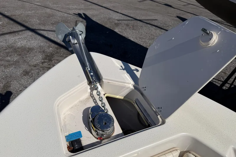 Slide: The Image of 2017 Sea Chaser 24 HFC boat anchor compartment with chain and winch. - 68