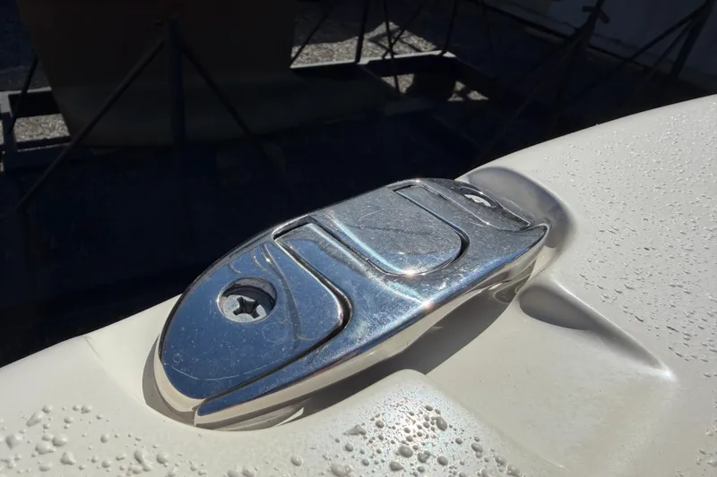 Slide: The Image of Chrome cleat on 2017 Sea Chaser 24 HFC boat, with water droplets. - 69