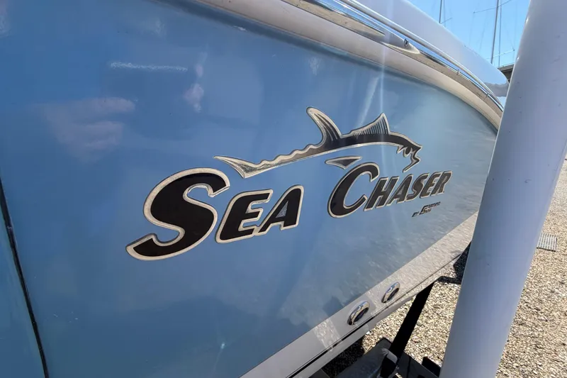 Slide: The Image of 2017 Sea Chaser 24 HFC boat with logo on blue hull. - 7
