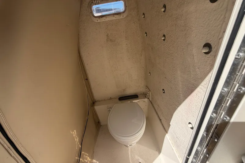 Slide: The Image of Interior view of 2017 Sea Chaser 24 HFC boat's compact bathroom with toilet. - 72
