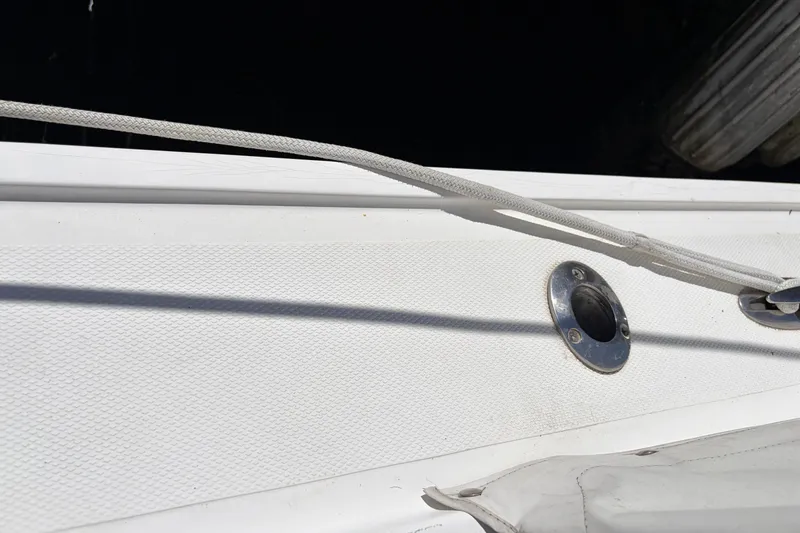 Slide: The Image of Close-up of 2005 Steiger Craft 23 Miami boat deck with rope and metal fitting. - 15
