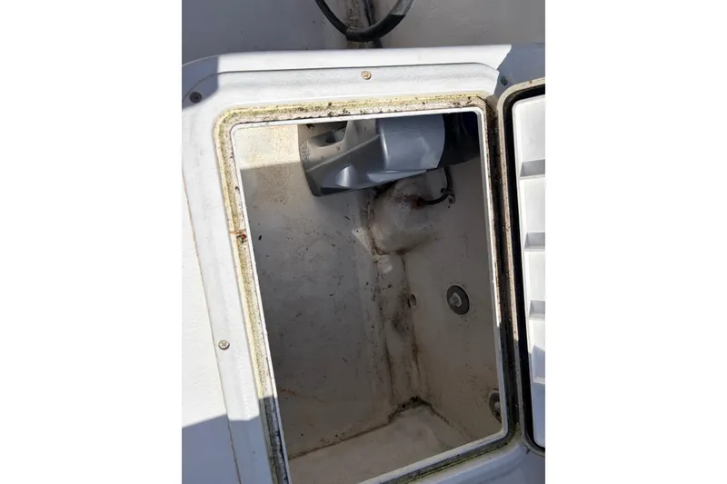 Slide: The Image of Open storage compartment on a 2005 Steiger Craft 23 Miami boat. - 22
