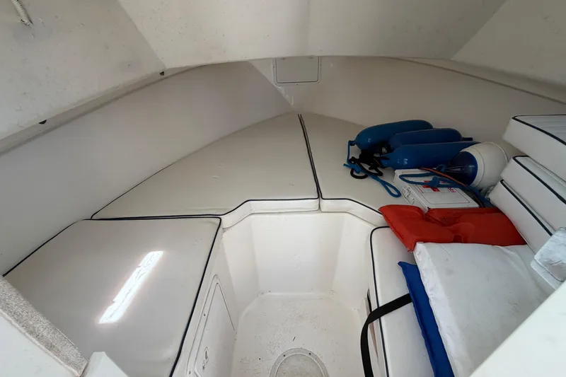 Slide: The Image of 2005 Steiger Craft 23 Miami cabin interior with cushions and safety equipment. - 29