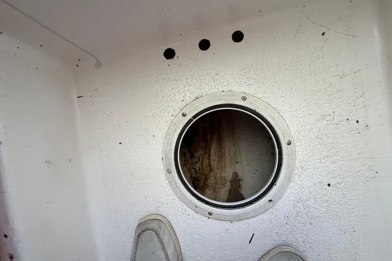 Slide: The Image of Interior view of a 2005 Steiger Craft 23 Miami boat with circular hatch. - 33