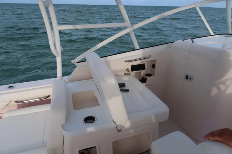 Slide: The Image of 2018 Grady-White Freedom 307 boat interior with ocean view. - 12