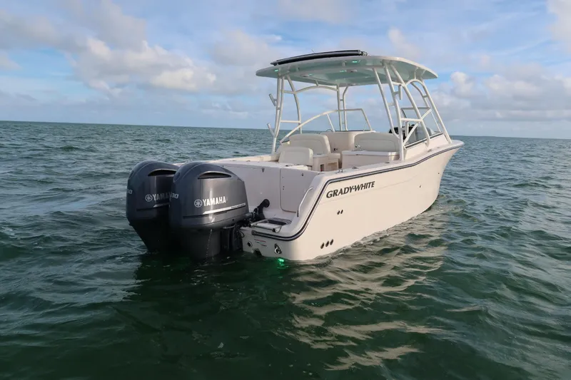 Slide: The Image of 2018 Grady-White Freedom 307 boat with Yamaha engines on open water. - 16