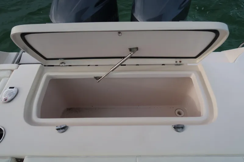 Slide: The Image of Open storage compartment on 2018 Grady-White Freedom 307 boat. - 17