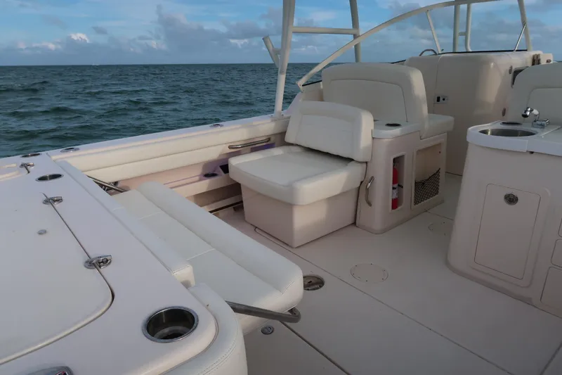 Slide: The Image of 2018 Grady-White Freedom 307 boat interior with seating and ocean view. - 8