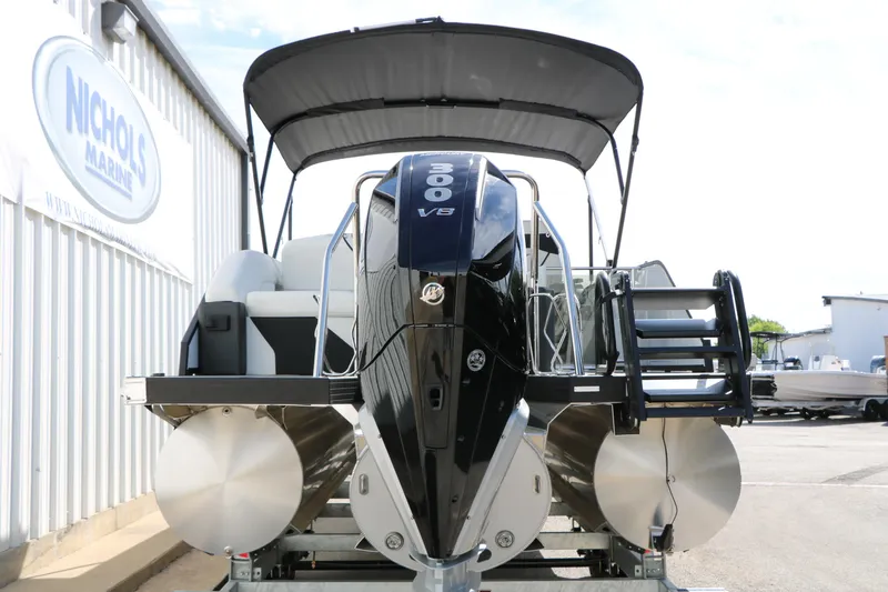 Slide: The Image of 2026 Evotti 725 CS Tri-Toon boat with powerful engine, displayed at Nichols Marine. - 18