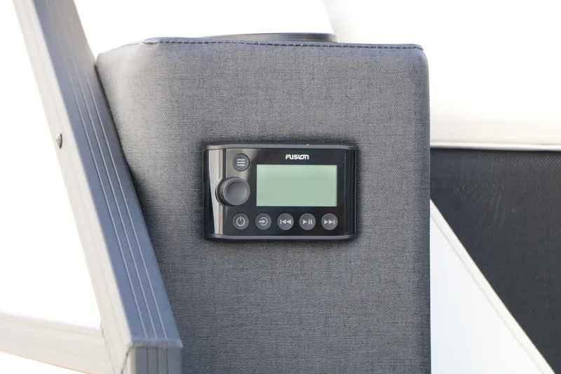 Slide: The Image of Control panel on 2026 Evotti 725 CS Tri-Toon boat, featuring Fusion audio system. - 22