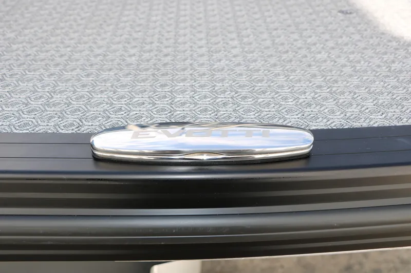 Slide: The Image of 2026 Evotti 725 CS Tri-Toon logo on textured surface, showcasing sleek design. - 28