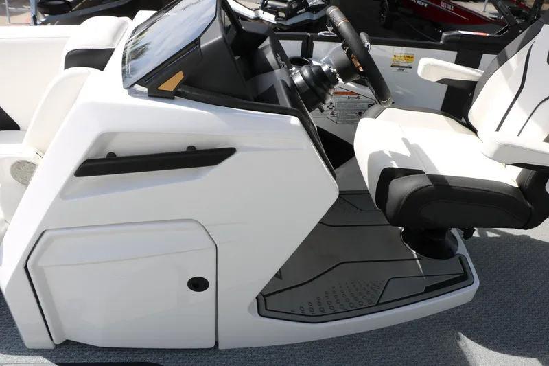 Slide: The Image of 2026 Evotti 725 CS Tri-Toon boat interior with modern steering console and seating. - 37