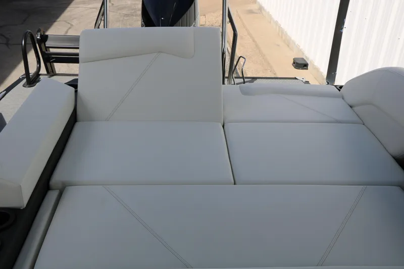 Slide: The Image of Luxurious seating on 2026 Evotti 725 CS Tri-Toon boat, featuring sleek white upholstery. - 41