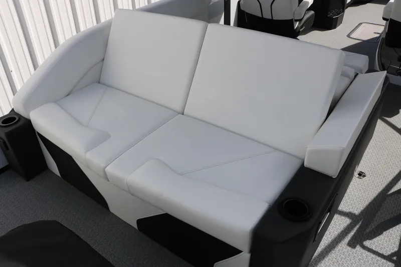 Slide: The Image of Luxurious white seating on 2026 Evotti 725 CS Tri-Toon boat, featuring cup holders and modern design. - 42