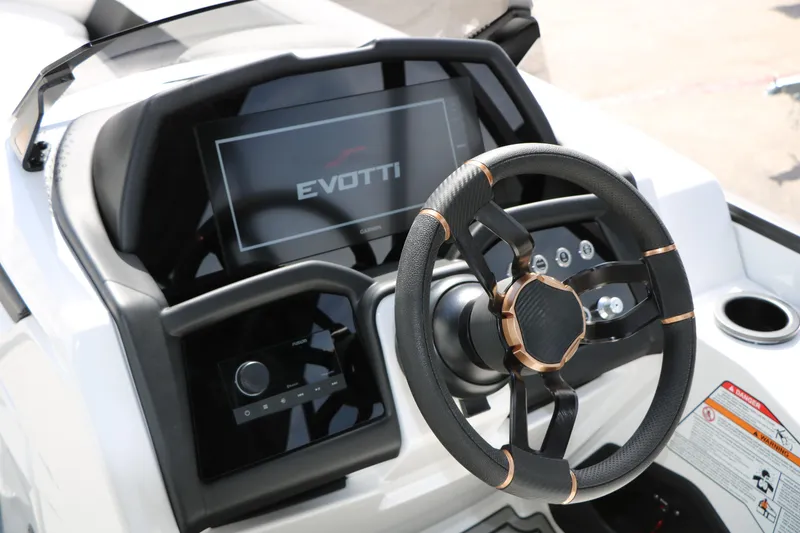 Slide: The Image of Steering console of 2026 Evotti 725 CS Tri-Toon with modern dashboard and controls. - 49