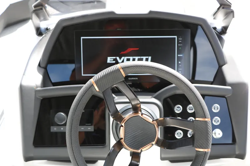Slide: The Image of Steering wheel and dashboard of 2026 Evotti 725 CS Tri-Toon boat, featuring modern controls. - 50