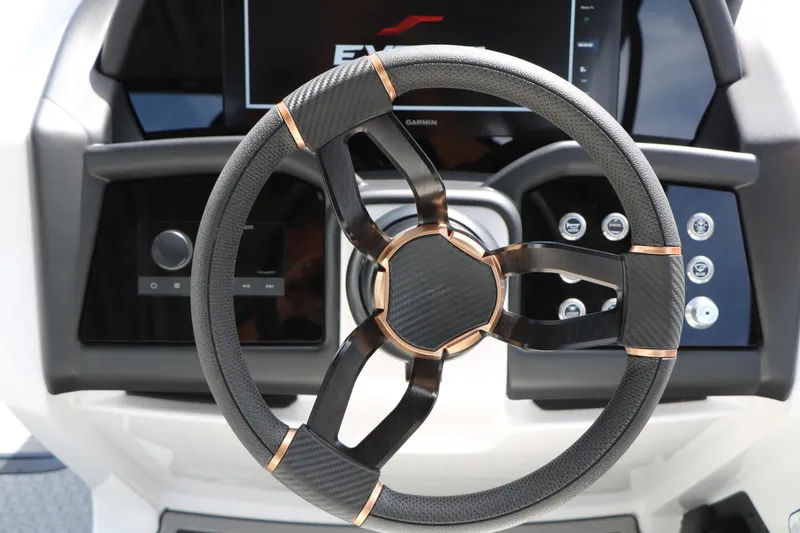 Slide: The Image of Steering wheel of 2026 Evotti 725 CS Tri-Toon with modern dashboard controls. - 51