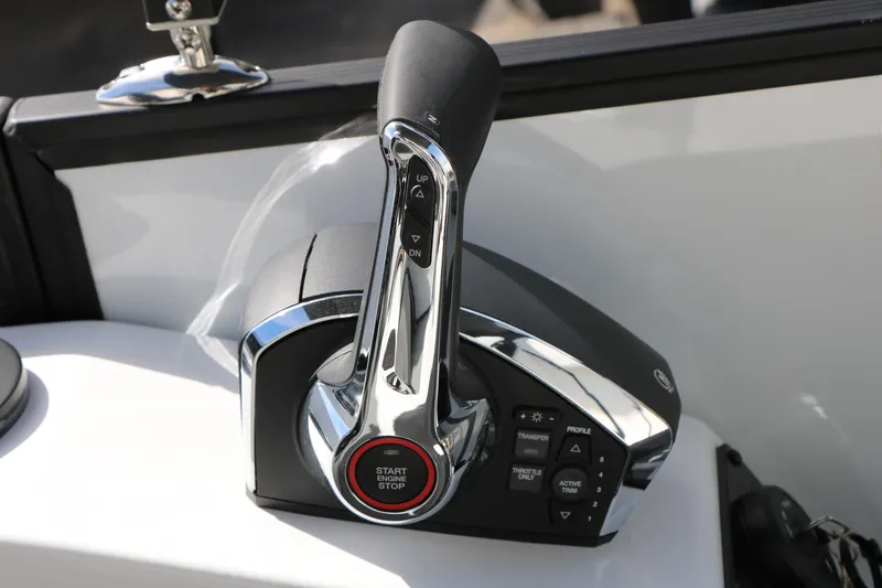 Slide: The Image of Throttle control of 2026 Evotti 725 CS Tri-Toon boat, featuring start/stop button and trim controls. - 53