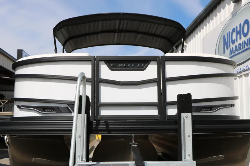 Slide: The Image of 2026 Evotti 725 CS Tri-Toon boat at marina, showcasing sleek design and modern features. - 6