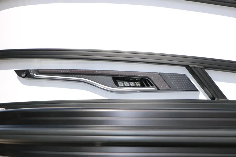 Slide: The Image of Close-up of 2026 Evotti 725 CS Tri-Toon boat detail with sleek design elements. - 8