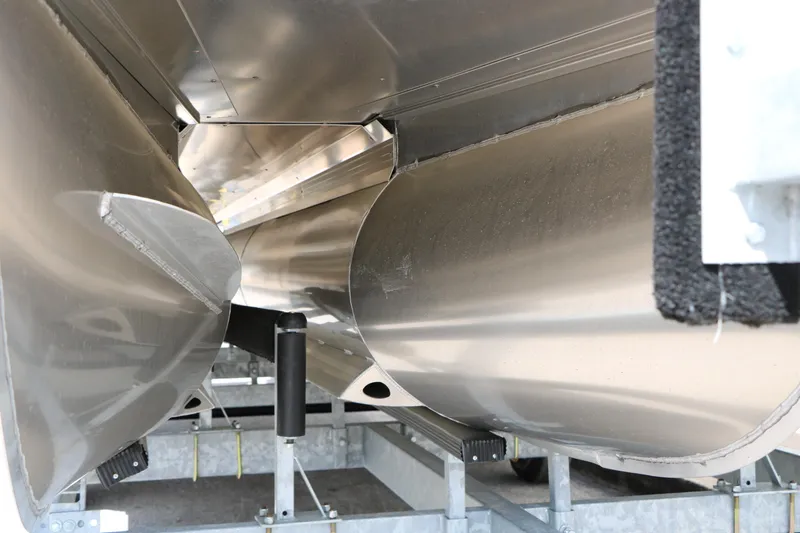 Slide: The Image of Close-up of 2026 Evotti 725 CS Tri-Toon pontoon boat hull on trailer. - 9
