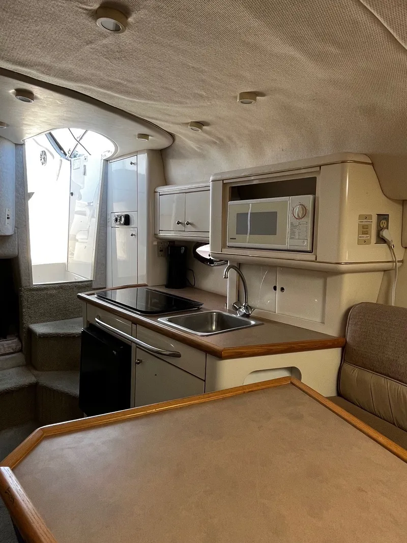 Slide: The Image of Interior of 1998 Maxum 2700 SCR yacht with kitchenette. - 14