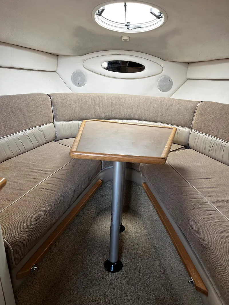 Slide: The Image of Interior of a 1998 Maxum 2700 SCR boat with seating area. - 16