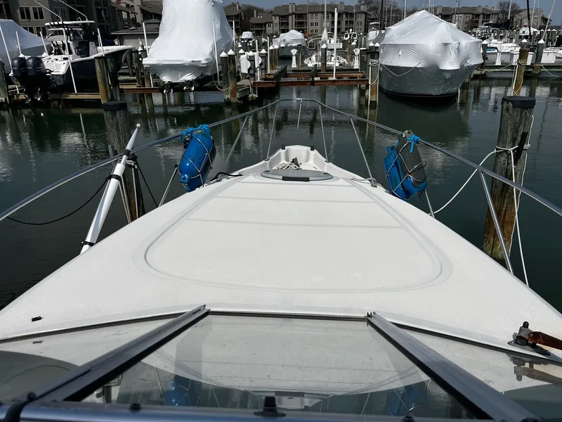 Slide: The Image of 1998 Maxum 2700 SCR docked in a marina. - 6