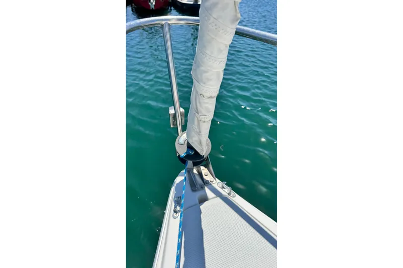 Slide: The Image of Bow of 2003 Catalina 250 sailboat with clear water view. - 12