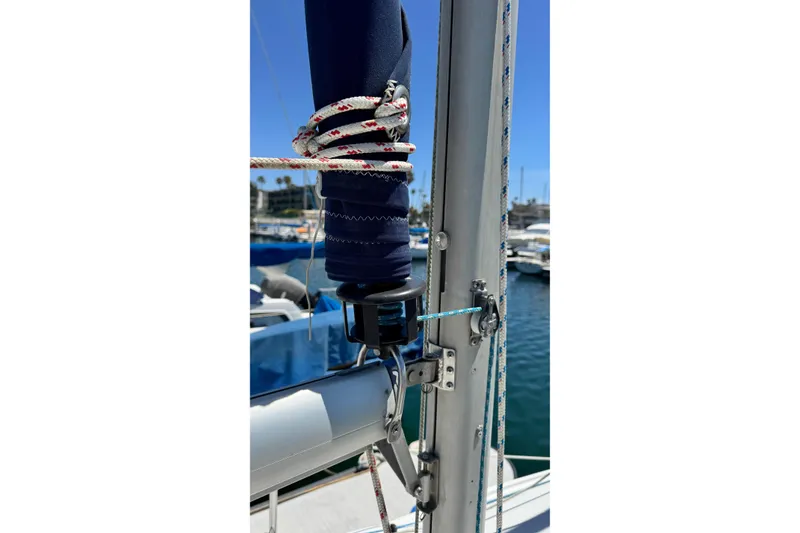 Slide: The Image of Close-up of a 2003 Catalina 250 sailboat mast with rigging and ropes. - 13