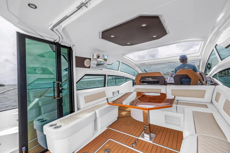 Slide: The Image of Luxurious interior of 2019 Beneteau Gran Turismo 46 yacht with elegant seating and helm. - 16