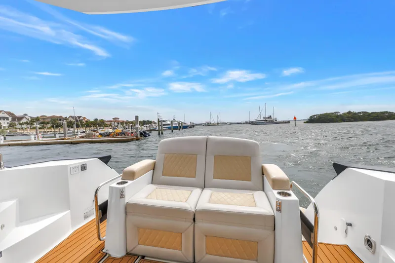 Slide: The Image of 2019 Beneteau Gran Turismo 46 yacht with luxurious seating, cruising on a sunny day. - 17